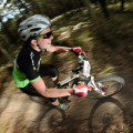 Winners are grinners! Kath Bicknell on her way to winning the Mixed Pairs category