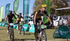 Contego rider Louis-Bresler Knipe (right) and team-mate Kevin van Hoovels (centre) celebrate their stage win on day four of the nine-day Old Mutual joBerg2c on Monday. RE:CM’s Waylon Woolcock (left) and Lourens Luus (obscured) retain the overall lead. Photo: Full Stop Communications/Old Mutual joBerg2c