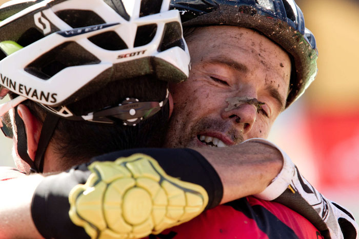 David George embraces his teammate, Kevin Evans, after the stage. Photo: Greg Beadle/Cape Epic/SPORTZPICS