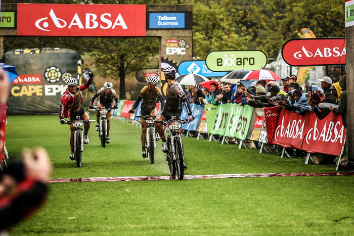 Tim Böehme of Team Bulls crosses the line first, but Stander and Sauser win the wet and wild stage. Photo: Sportgraf