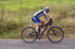 Garry Millburn rounds the final corner to take victory in the 50km race. Photo: Richie Tyler
